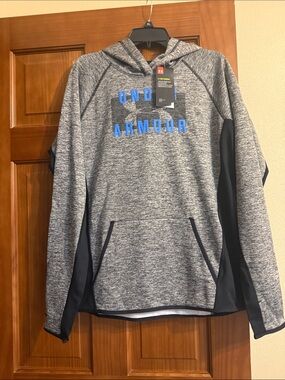 Under Armour Gray and Navy Hooded women’s  Pullover with Blue Logo. Brand new.
